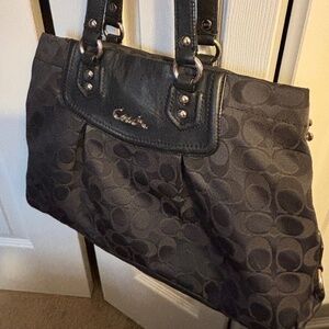 Coach handbag. Canvas with leather trim and silver hardware.